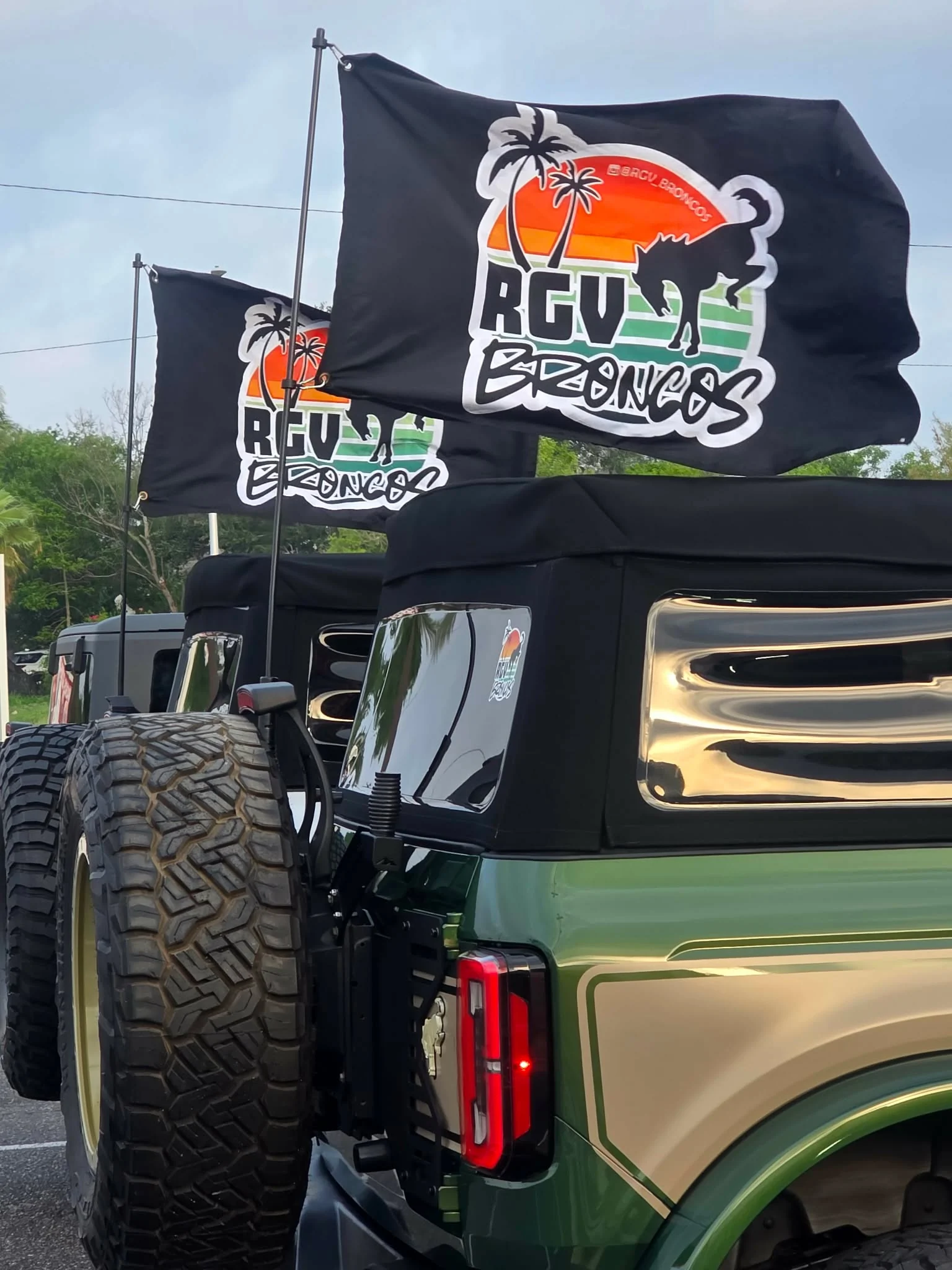 RGV Broncos flags flying above a row of Broncos at a community meetup